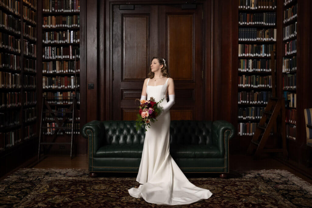 A classic portrait of a bride in an Ines di Santo gown in the library at a classic wedding at The Union League of Philadelphia. 