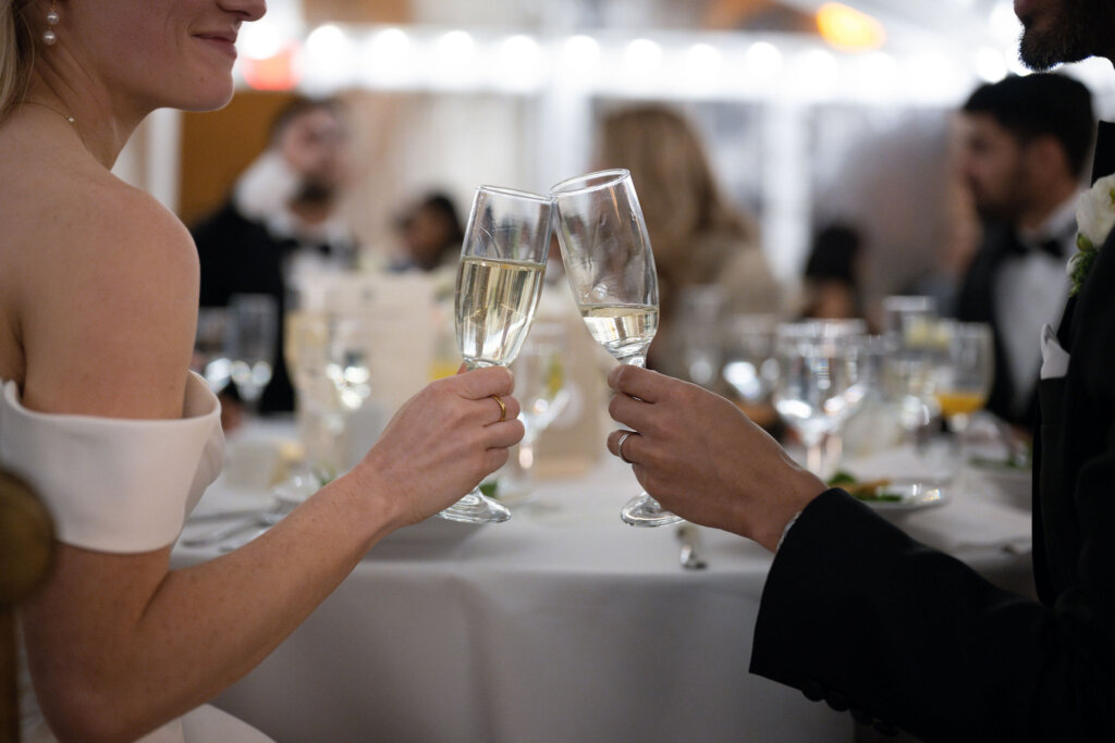 A bride and groom toast at their wedding Reception at American Swedish Historical Museum in Philadelphia, PA