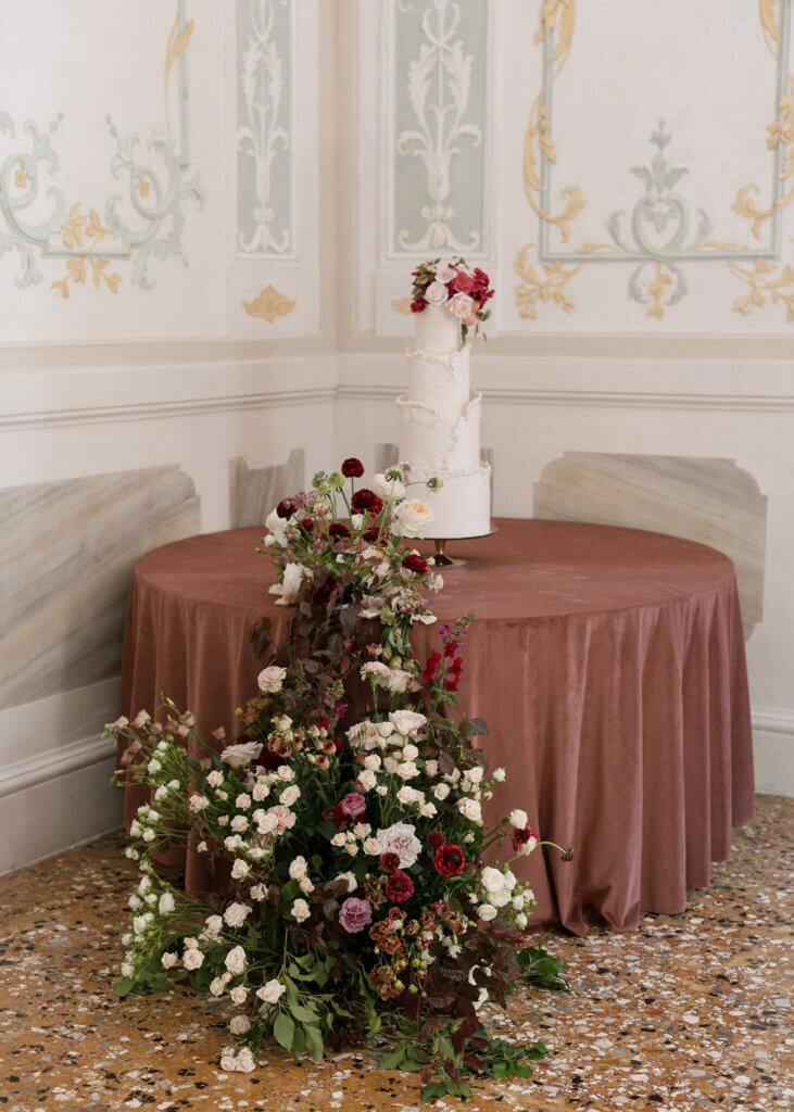 The muted floral and cake details at an Italy Destination Wedding at the Hotel Monaco & Grand Canal in Venice.