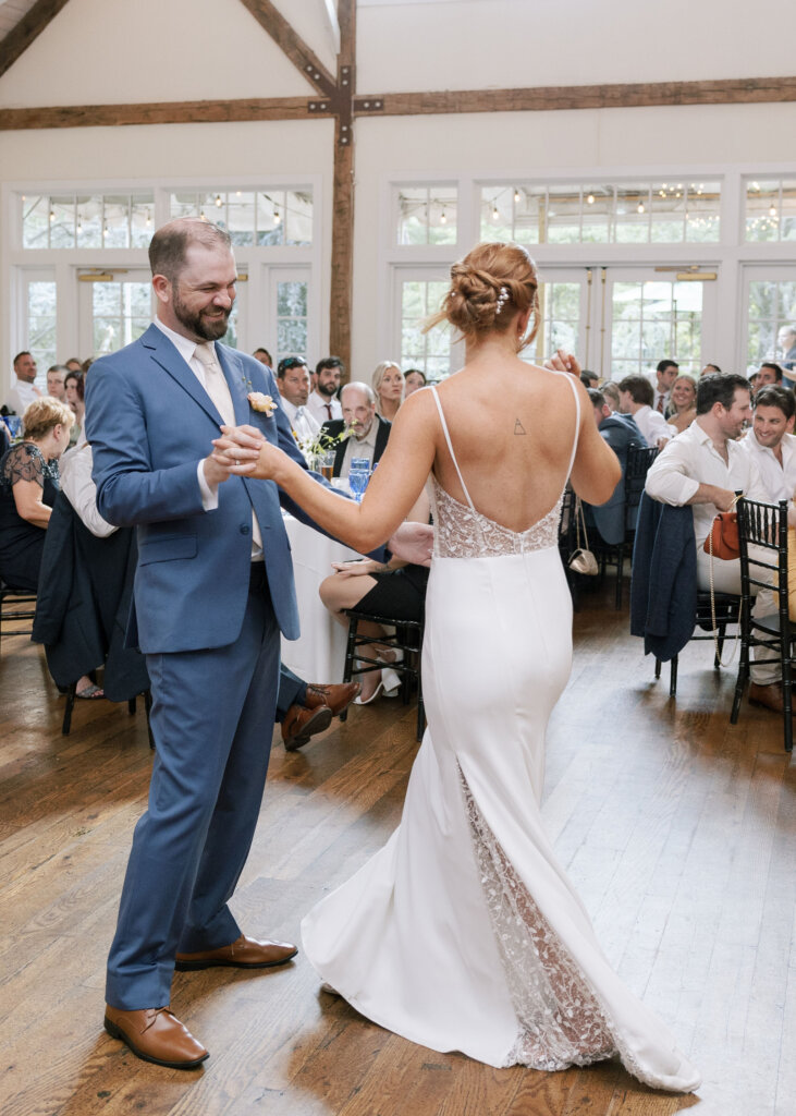 The bride's dress twirls as she enjoys her first dance with her husband on the dance floor of Riverdale Manor in Lancaster, Pennsylvania.