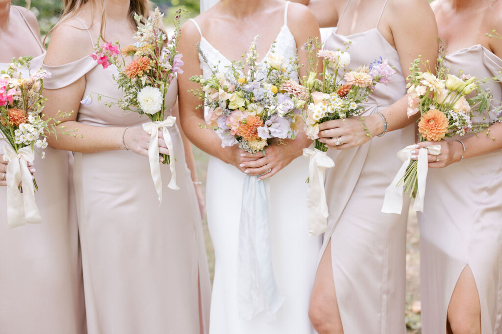 A close-up of the bride and her bridesmaids' floral bouquets from Waverly Flower Co. at Riverdale Manor in Lancaster, Pennsylvania.