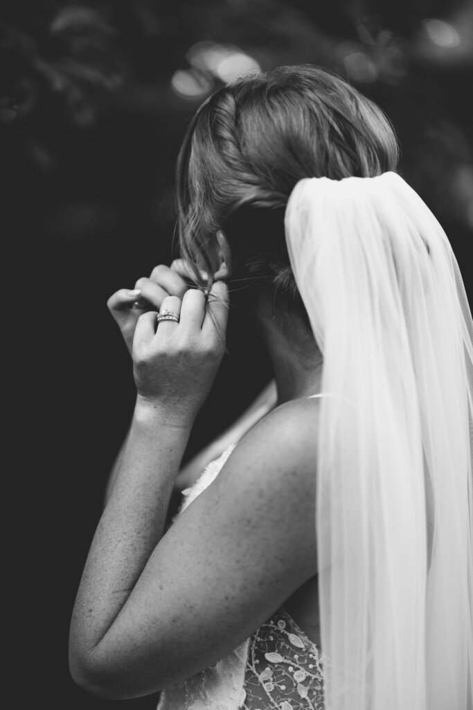 The bride putting in her earrings for her wedding at Riverdale Manor in Lancaster, Pennsylvania.