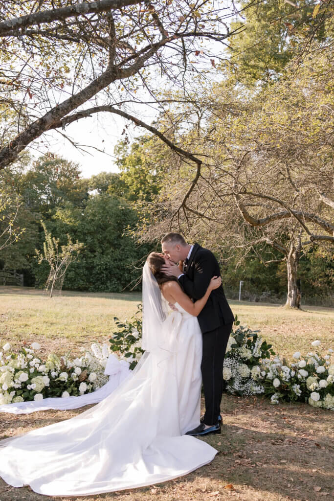 A beautiful and emotional first kiss at the ceremony at John James Audubon Center with Jeffrey Miller Catering.