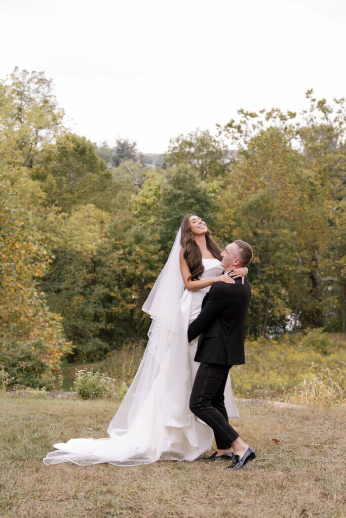 A portrait of a bride and groom at John James Audubon center.