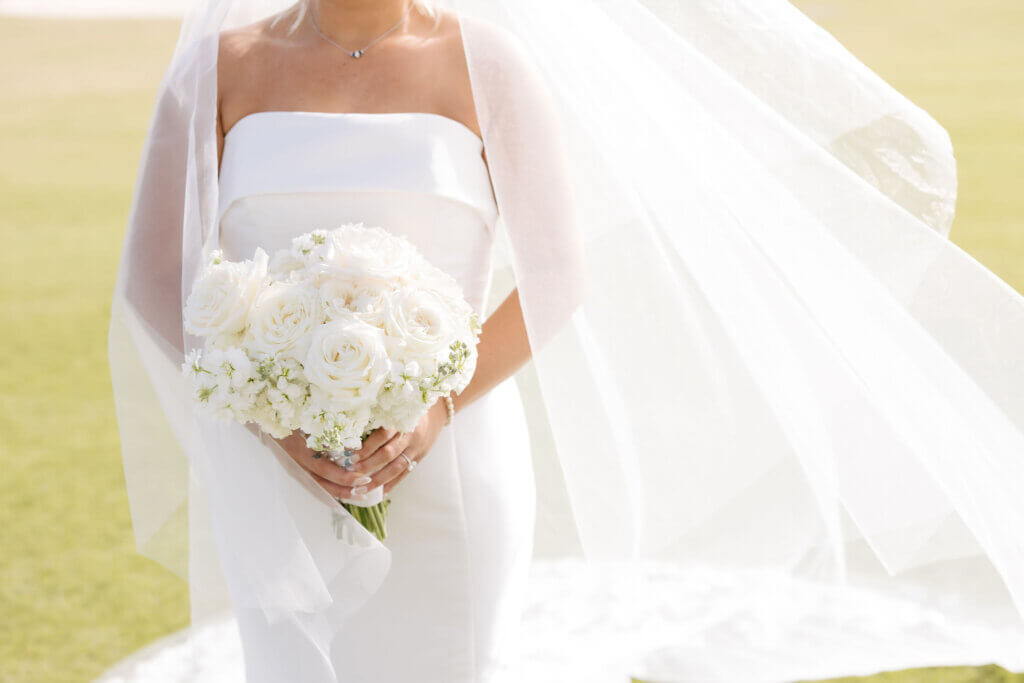 An all white floral bouquet for the bride at the Rehoboth Beach Country Club.