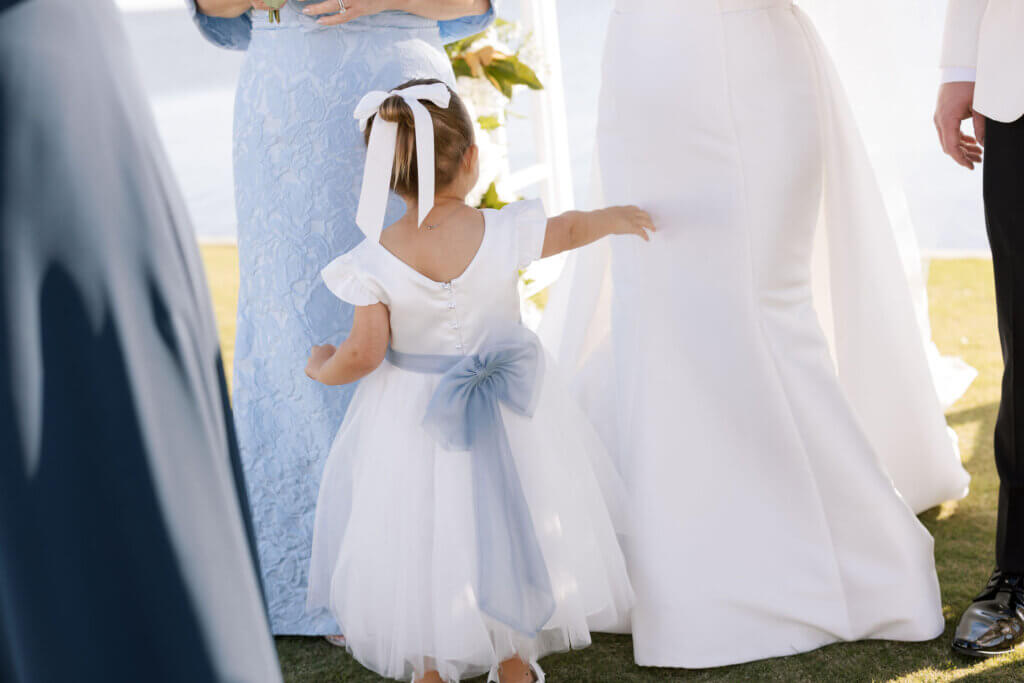 A candid portrait of the bridesmaids in printed dresses at the Rehoboth Beach Country Club. 