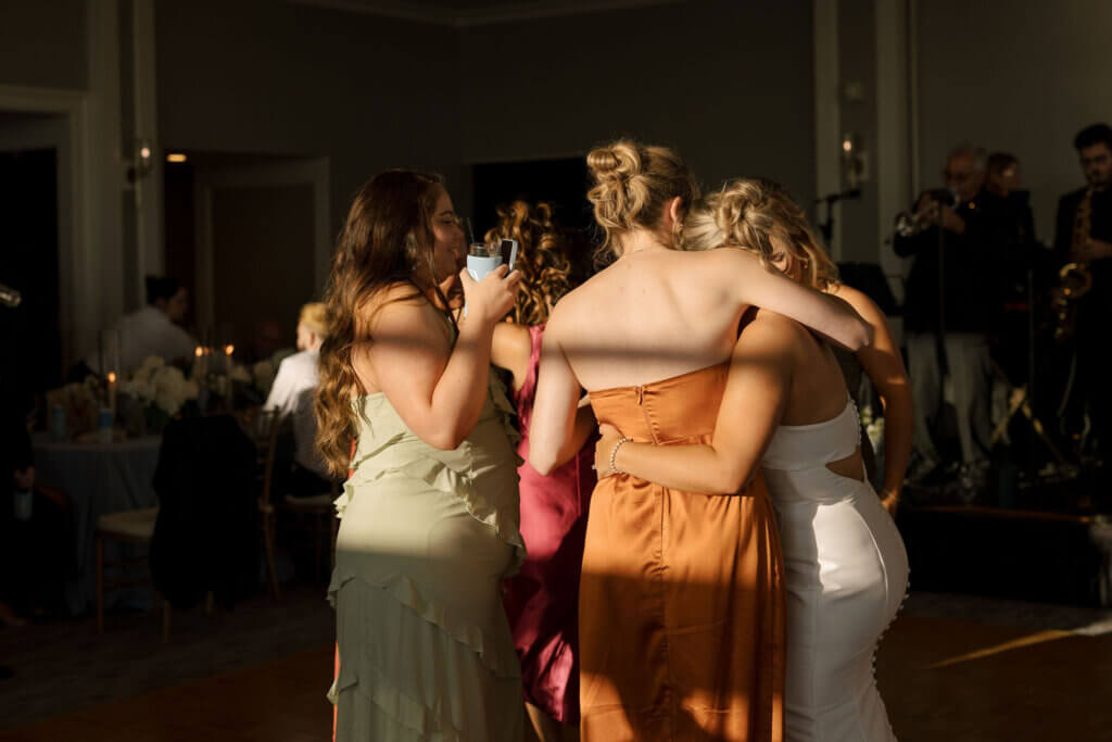 The guests dance in the sunset light at Rehoboth Beach Country Club. 