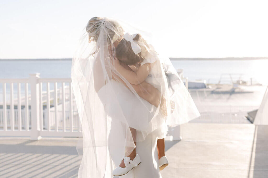 The bride dances with the flower girl at the cocktail hour at Rehoboth Beach Country Club. 