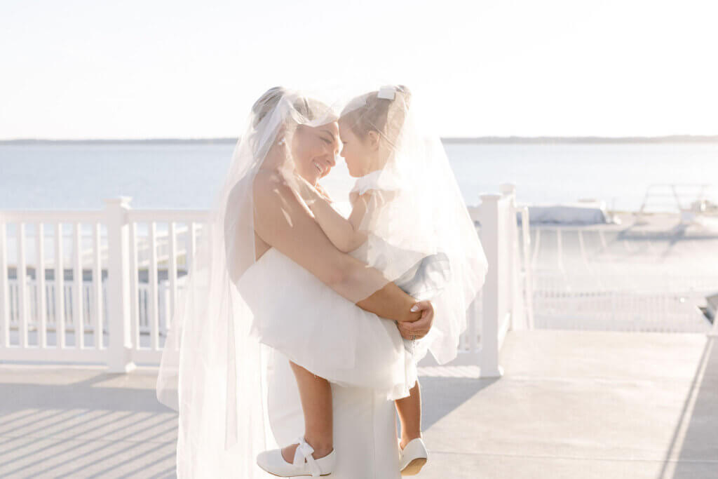 The bride dances with the flower girl at the cocktail hour at Rehoboth Beach Country Club. 