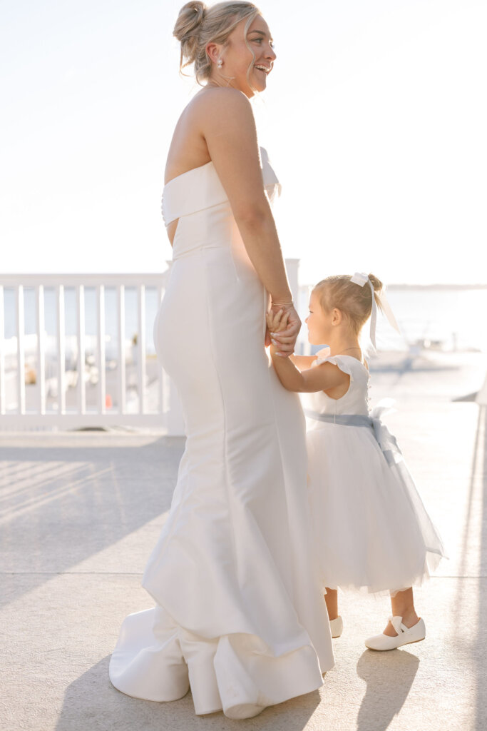 The bride dances with the flower girl at the cocktail hour at Rehoboth Beach Country Club. 