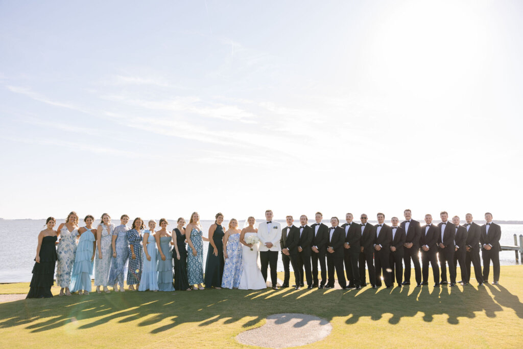 The bridal party gathers near the ceremony for portraits at Rehoboth Beach Country Club.