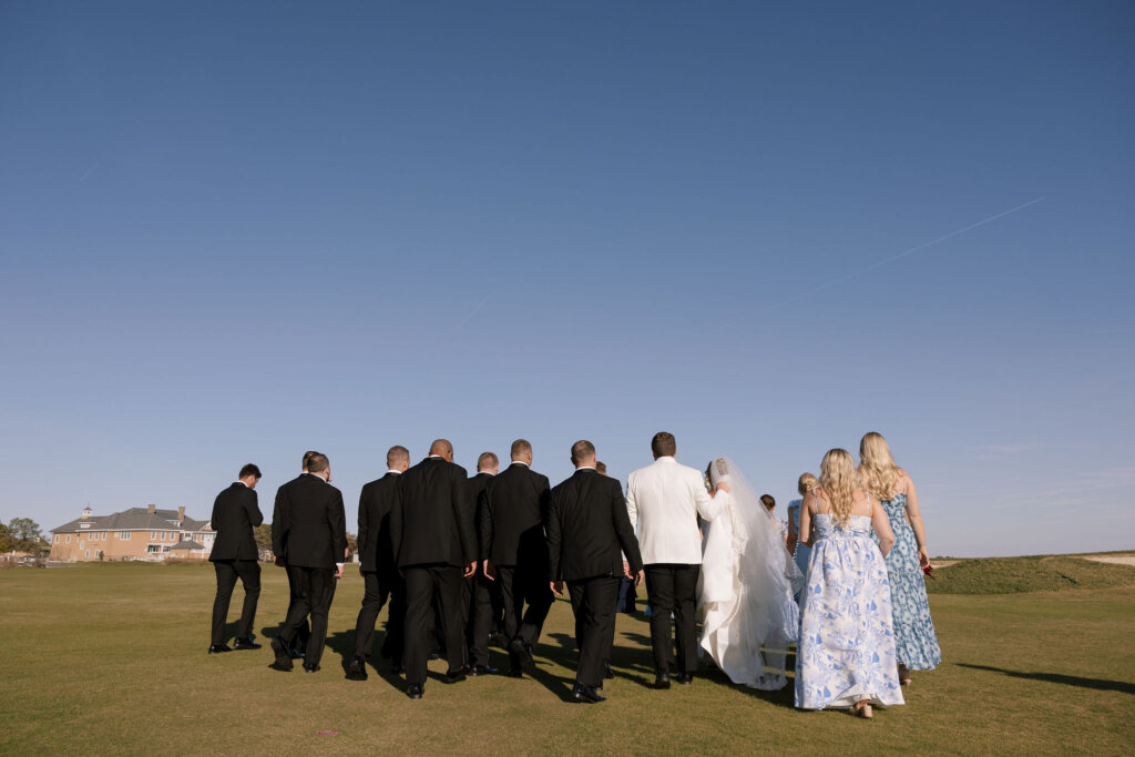 The bridal party gathers near the ceremony for portraits at Rehoboth Beach Country Club.