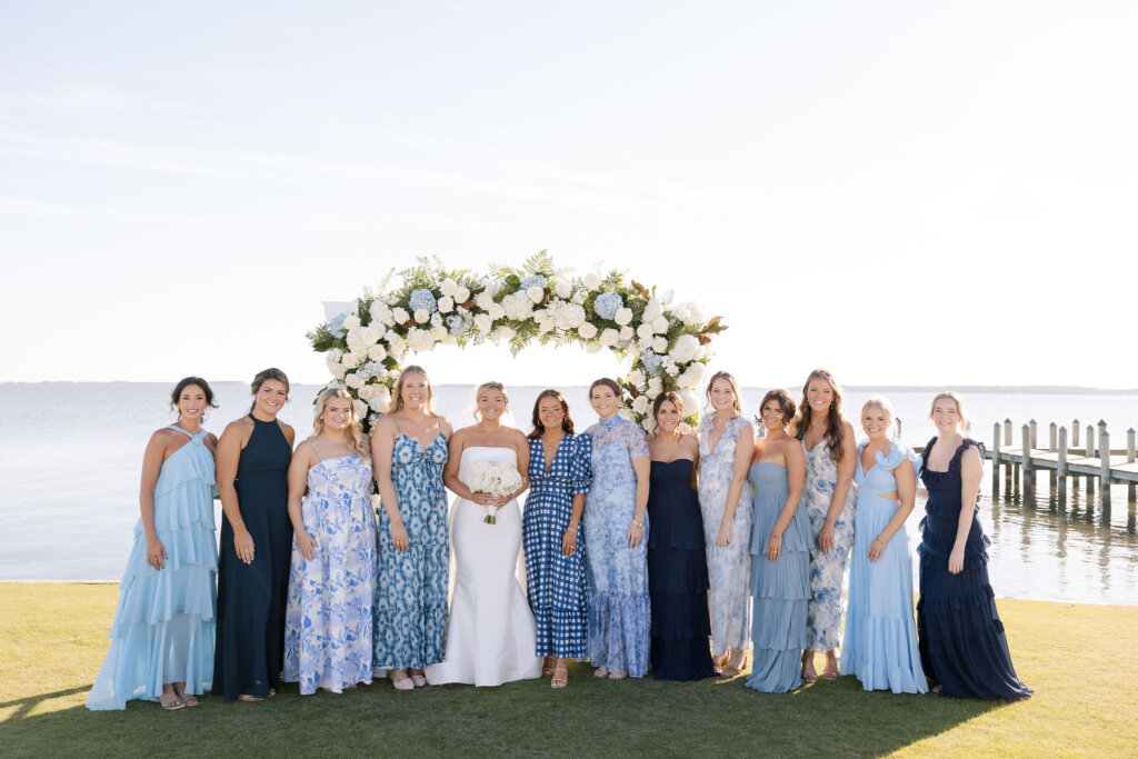 The bridal party gathers near the ceremony for portraits at Rehoboth Beach Country Club.