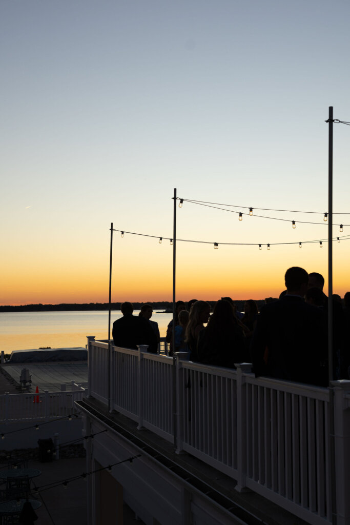 The sun sets perfectly after a wedding cocktail hour at Rehoboth Beach Country Club.