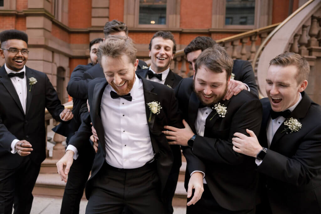 The groomsmen get ready before the wedding at the Crystal Tea Room.