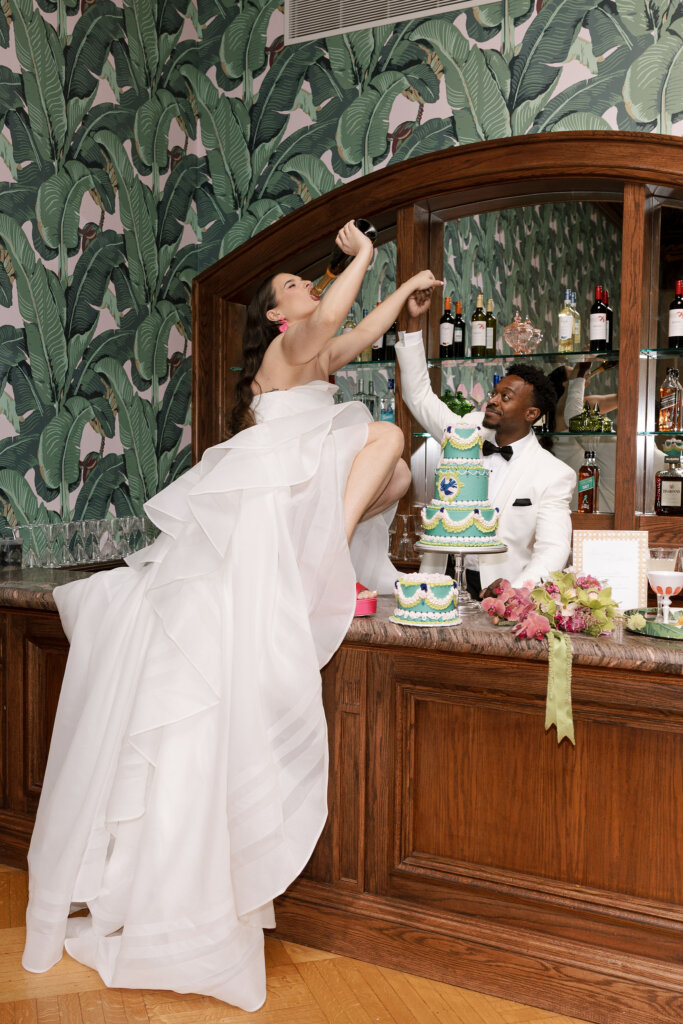 The bride and groom enjoy a champagne toast at their Elkins Estate wedding.