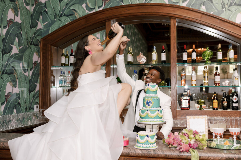 The bride and groom enjoy their cake by Velvet Sky Bakery at Elkins Estate.