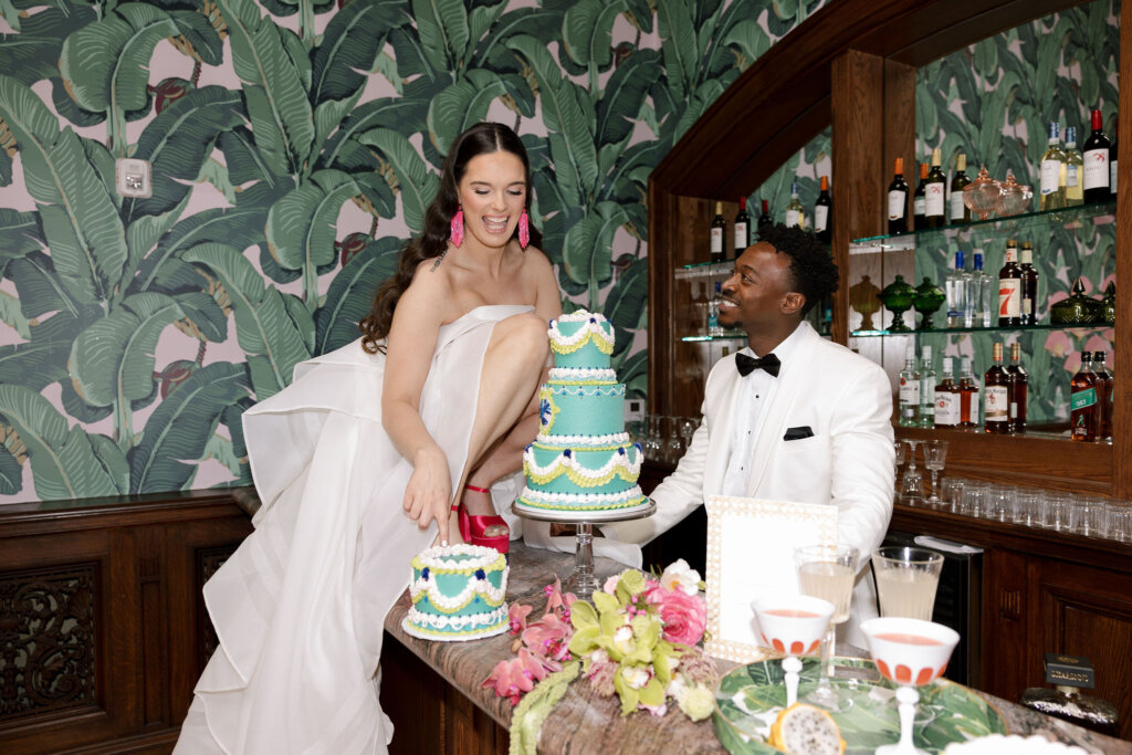 The bride and groom enjoy their cake by Velvet Sky Bakery at Elkins Estate.