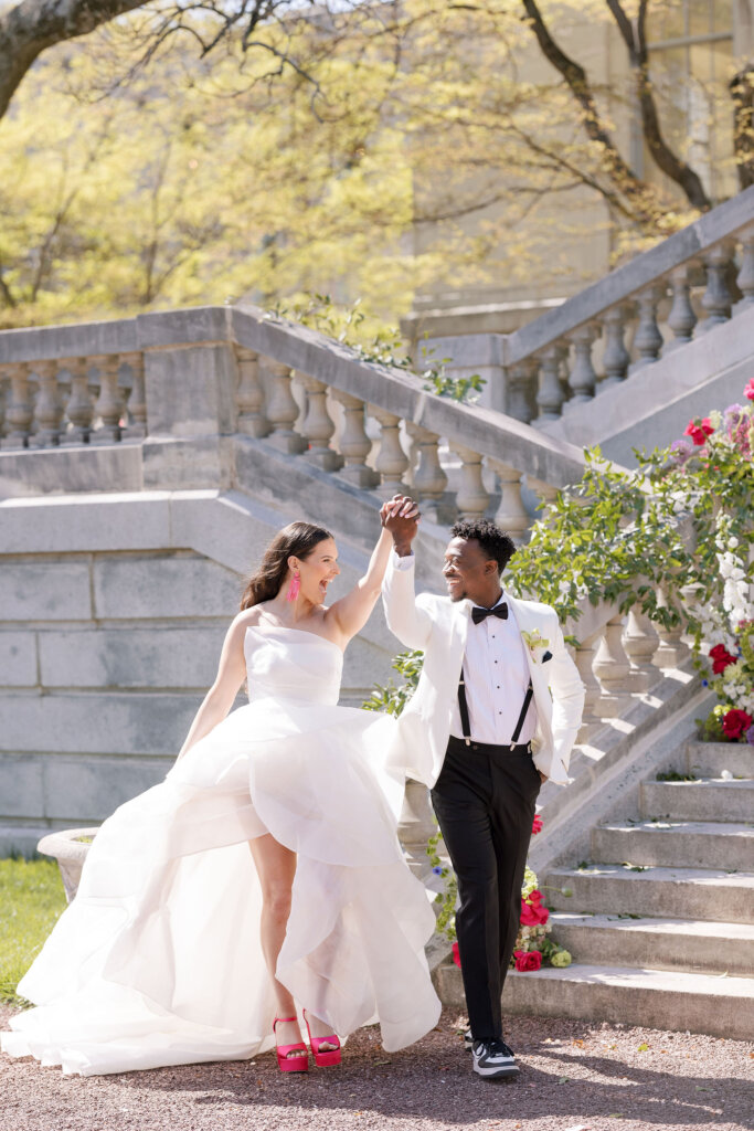 The bride and groom exit with excitement from their ceremony at Elkins Estate.