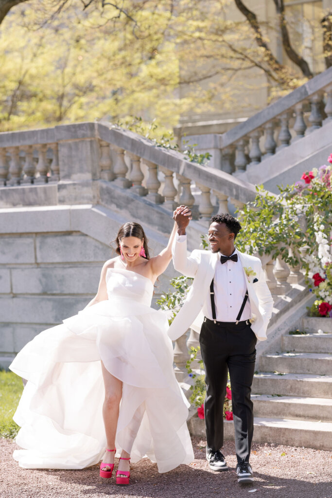 The bride and groom exit with excitement from their ceremony at Elkins Estate.