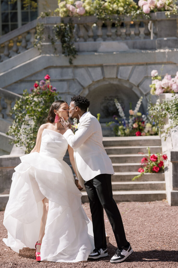 The bride and groom exit with excitement from their ceremony at Elkins Estate.