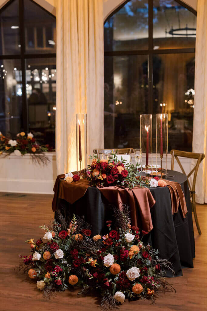 Lush, ethereal autumn florals in the table decor at a reception at Aldie Mansion.
